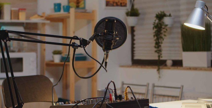 Microphone and mixer for podcast of famous influencer. Recording social media content with production microphone. Digital web internet streaming station